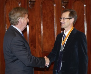 Victoria's Deputy Premier the Hon Peter Ryan presents Dr Geoff Brent with his CEEC Medal